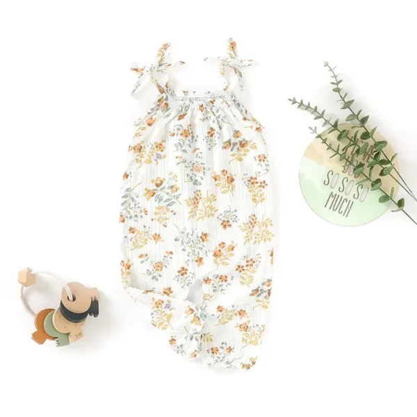 A white dress with flowers and teddy bears on it